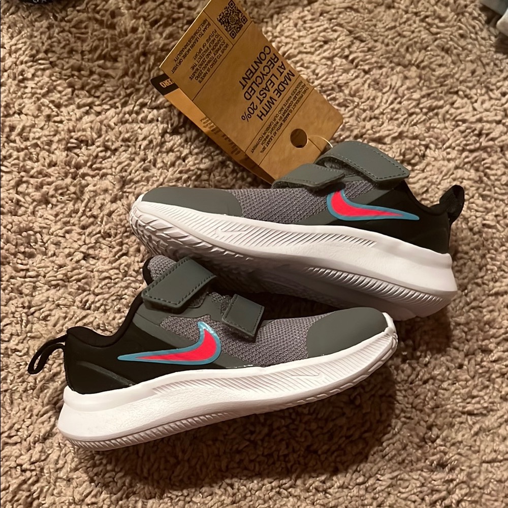 Kids Nike Gray and Black Sneakers with Red and Blue Accents